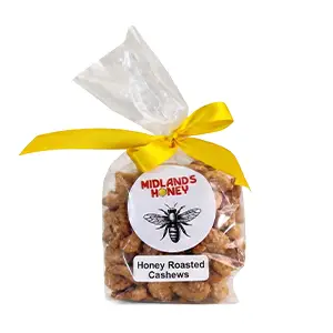 Midlands Honey Roasted Cashews in a cellophane bag tied with a yellow ribbon